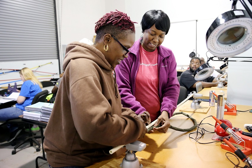 Starkville resident Kim Coats, at left, and Columbus resident Teresa Brooks, work on a cable during an Avionics and Cabling course at East Mississippi Community College. Employees who complete aerospace-related programs at EMCC are in high demand by local manufacturers. Starkville resident Kim Coats, at left, and Columbus resident Teresa Brooks, work on a cable during an Avionics and Cabling course at East Mississippi Community College. Employees who complete aerospace-related programs at EMCC are in high demand by local manufacturers.